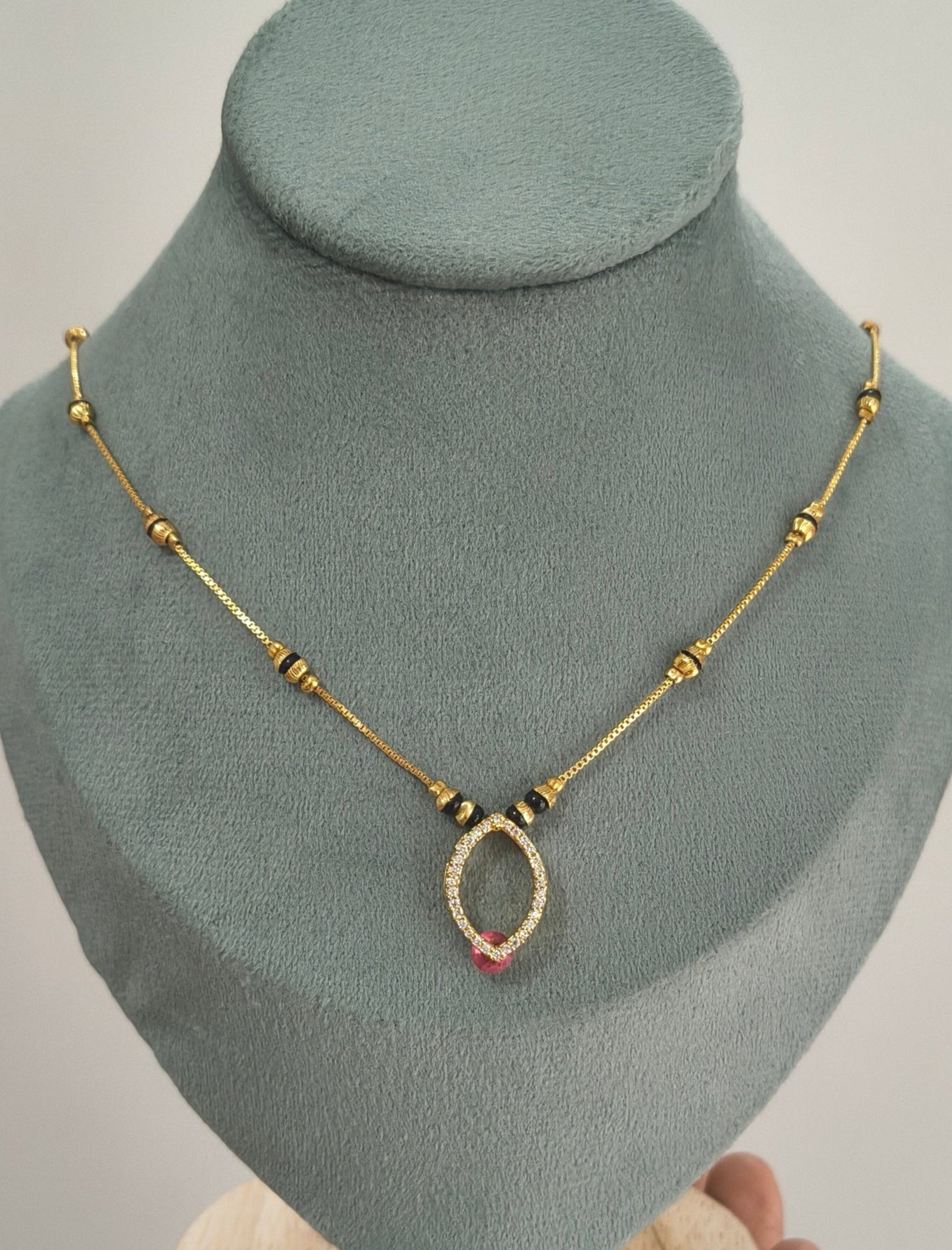 Daily Wear Black Beaded Hollow Oval Pendant Mangalsutra