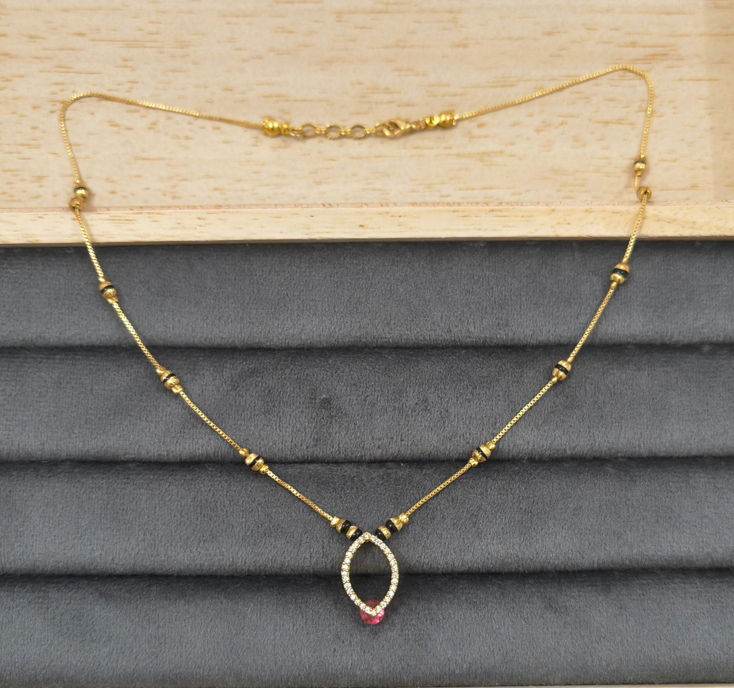 Daily Wear Black Beaded Hollow Oval Pendant Mangalsutra