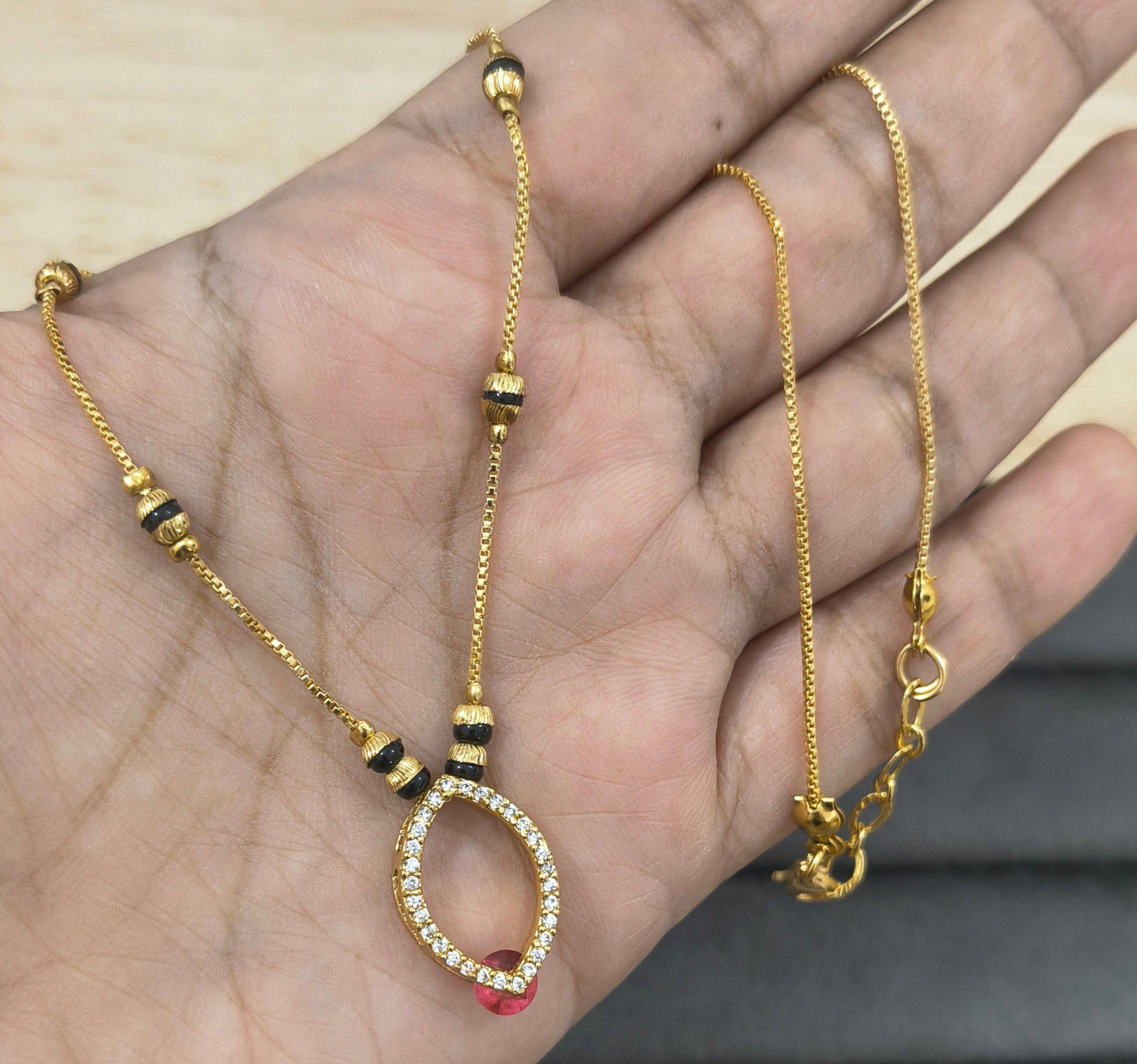Daily Wear Black Beaded Hollow Oval Pendant Mangalsutra