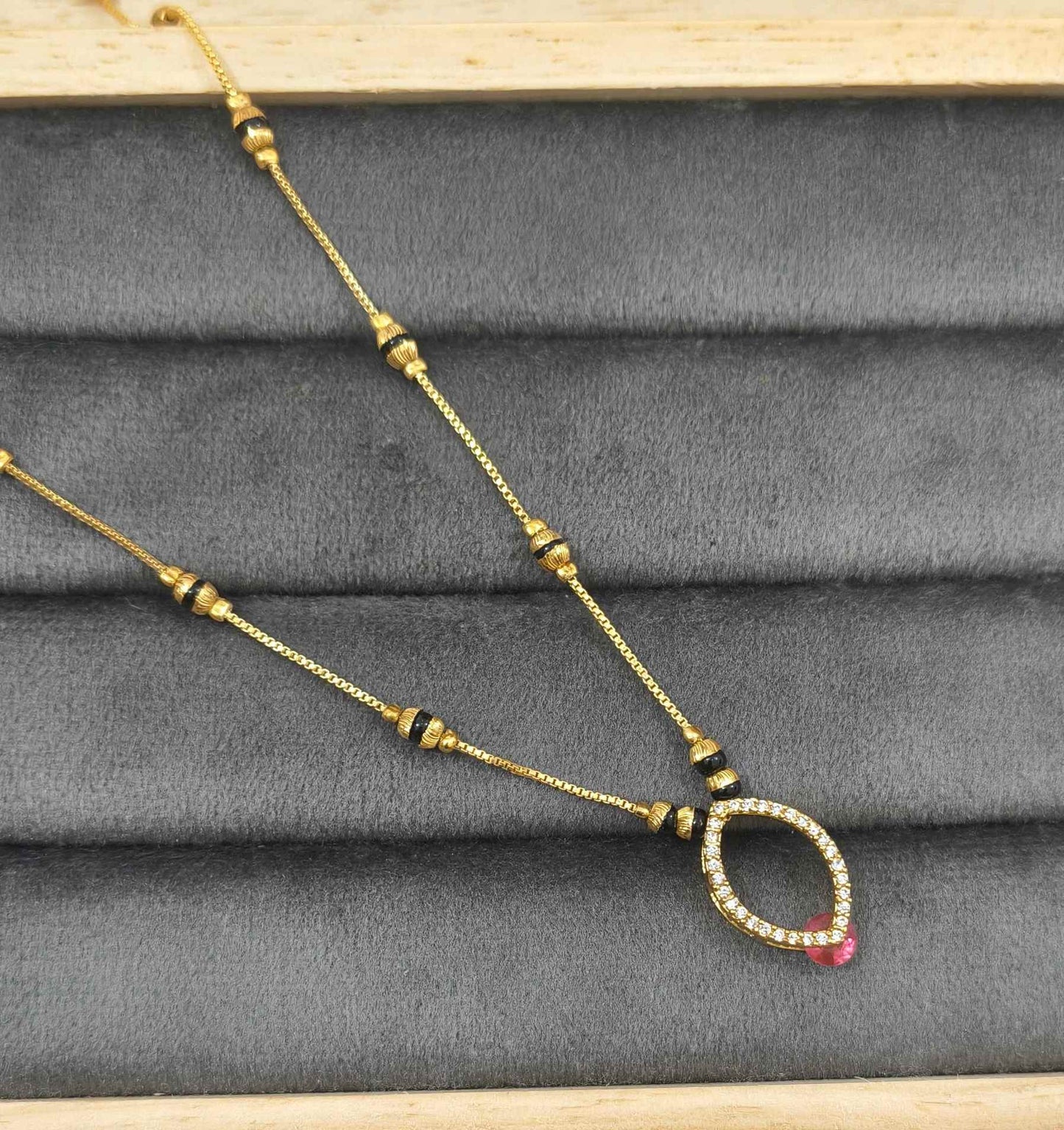 Daily Wear Black Beaded Hollow Oval Pendant Mangalsutra