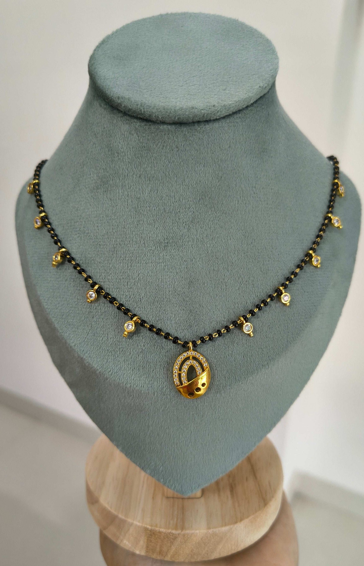 Dazzling Stone Studded Oval Pendant Beaded Mangalsutra Chain