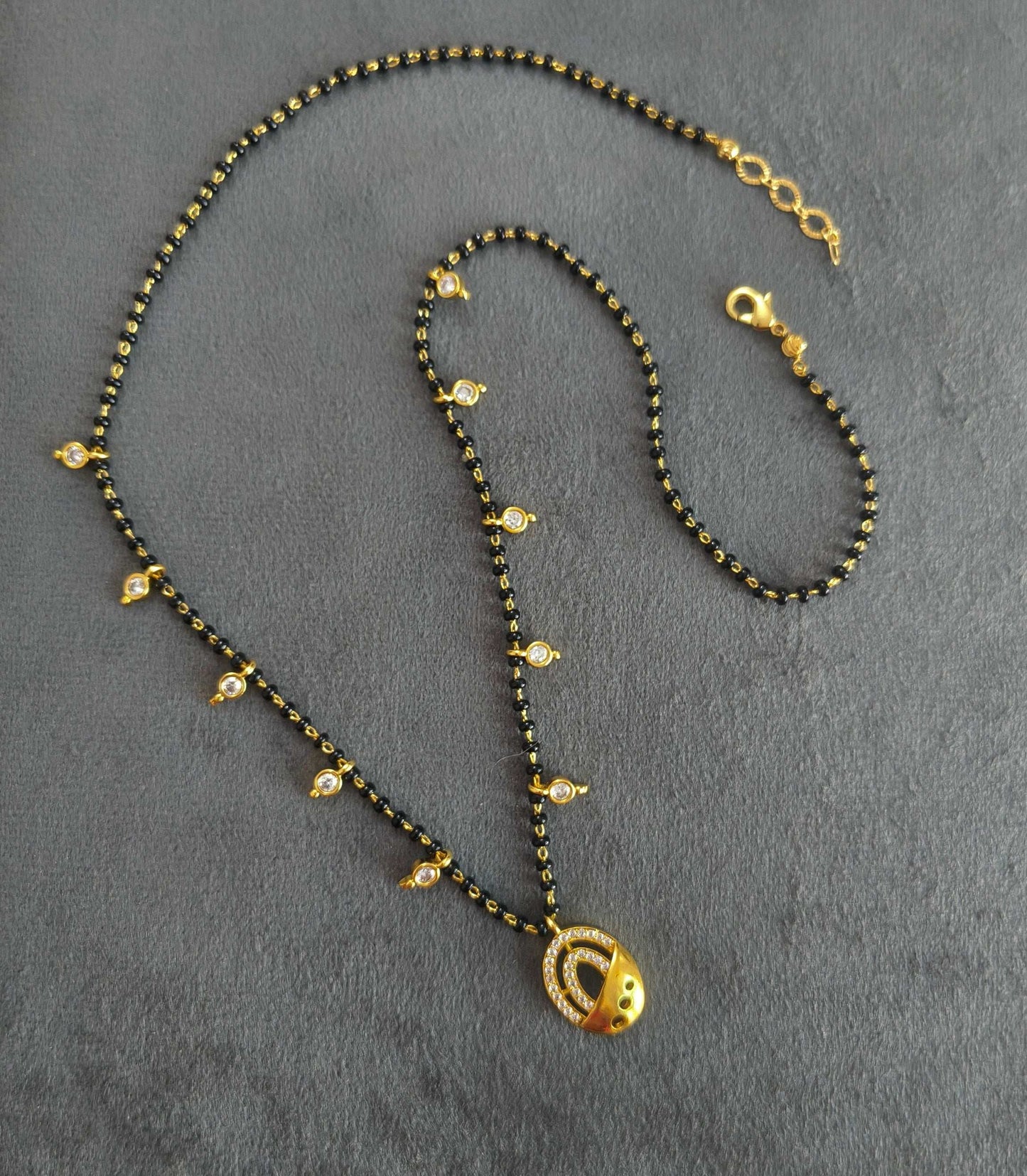 Dazzling Stone Studded Oval Pendant Beaded Mangalsutra Chain