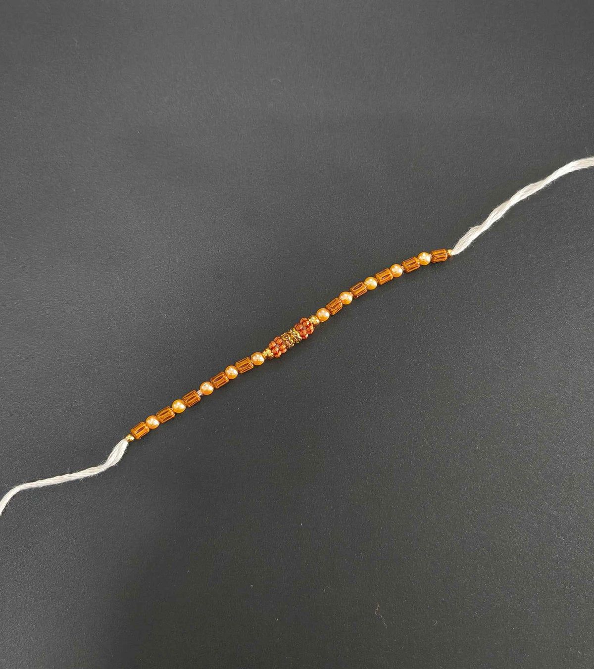 Designer Golden and Wooden Beads Rakhi for Brother
