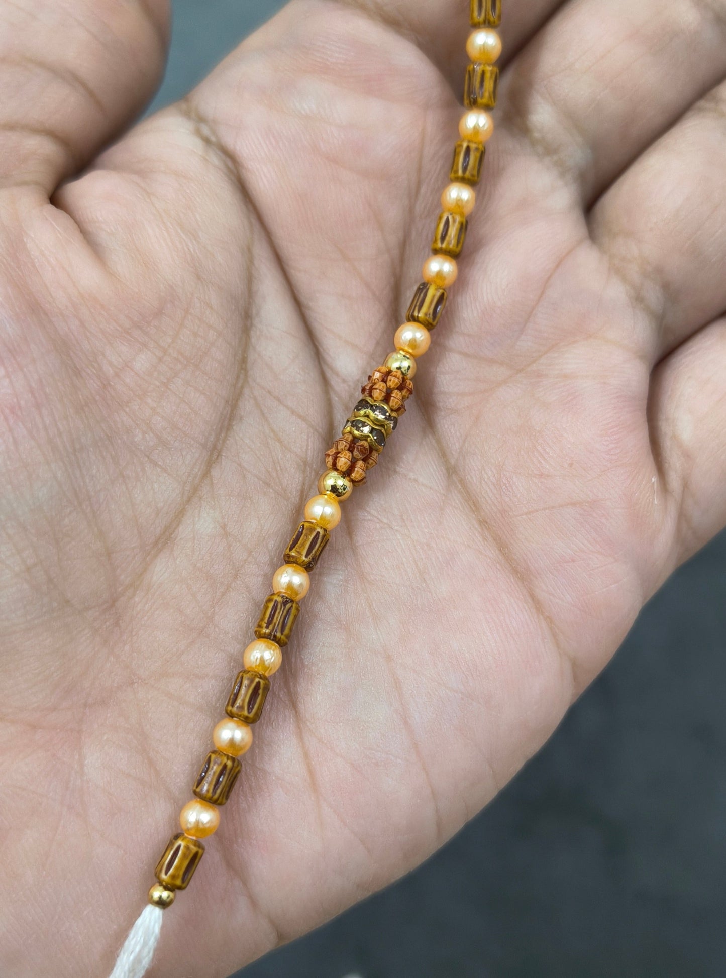 Designer Golden and Wooden Beads Rakhi for Brother