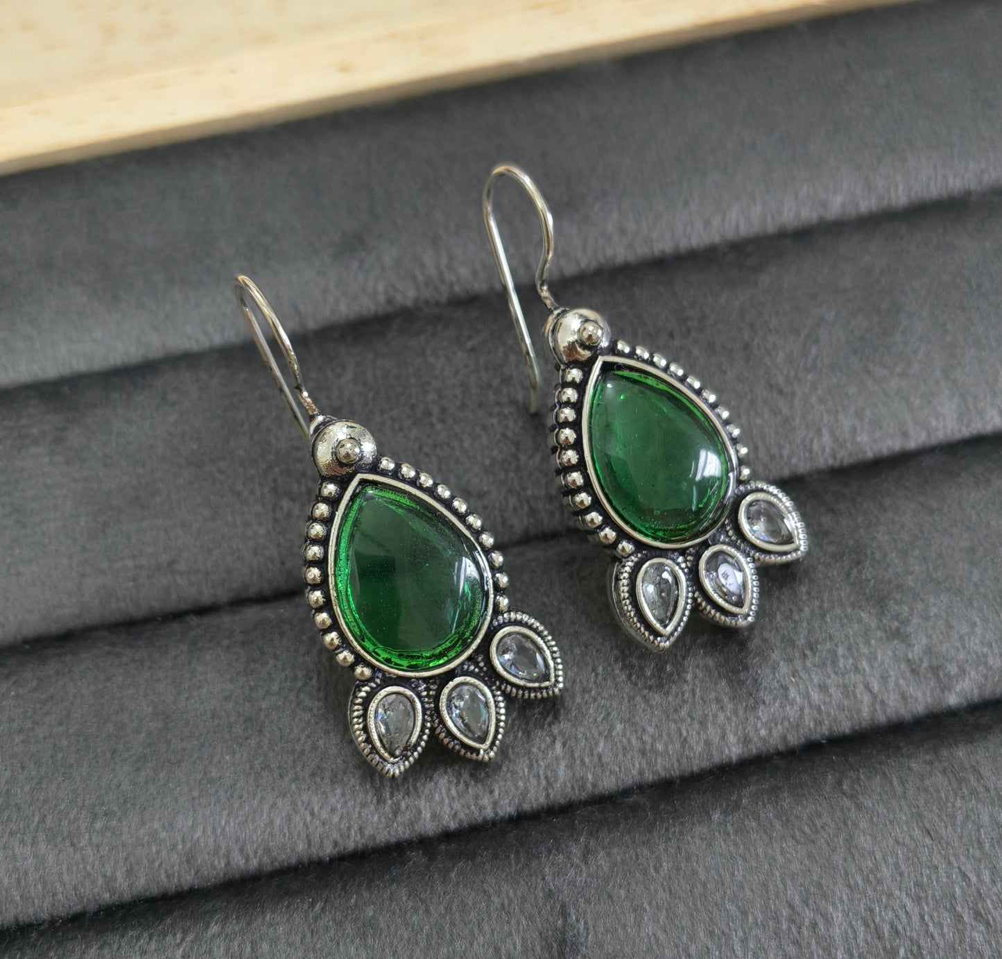 German Silver Toned Emerald Stone Studded Earrings