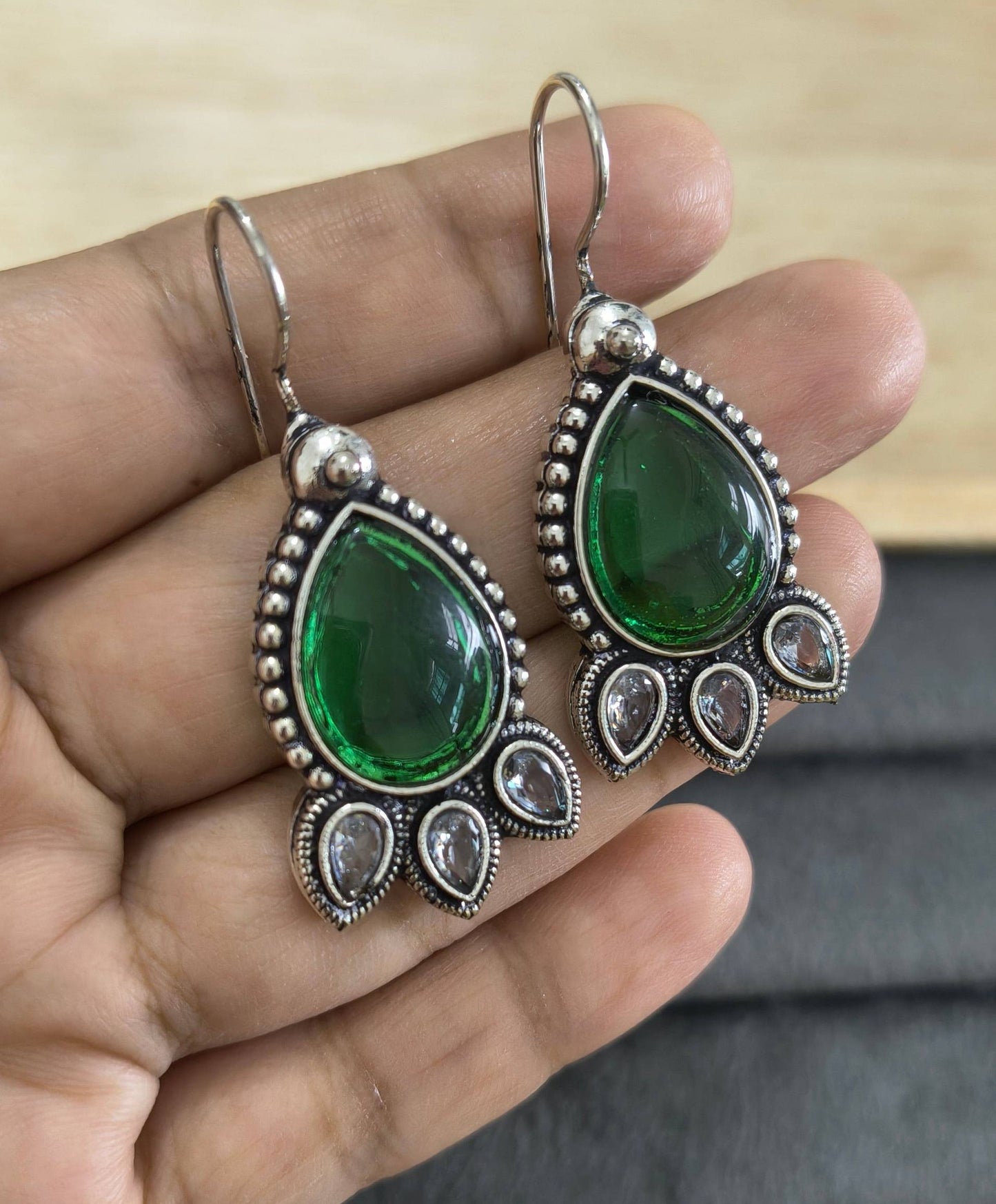 German Silver Toned Emerald Stone Studded Earrings