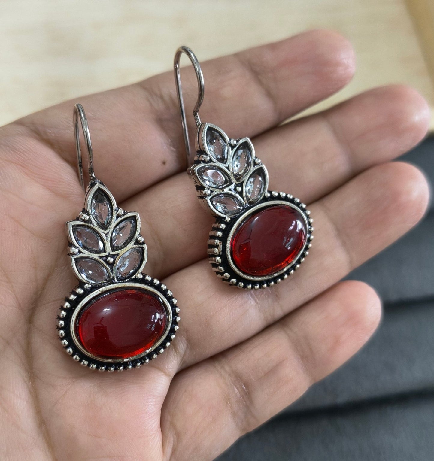 German Silver Toned Red Colored Stone Studded Earrings
