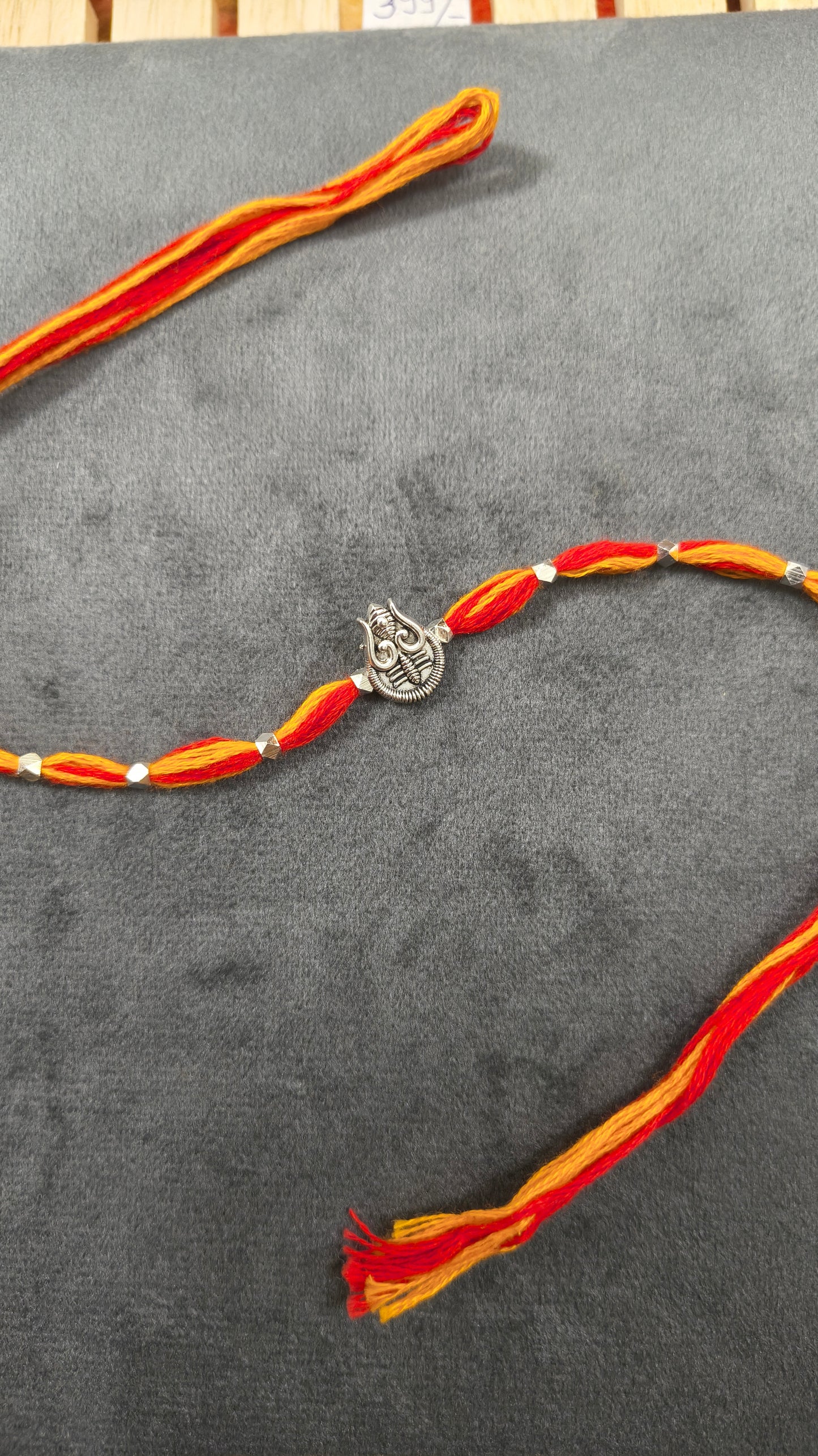 Auspicious Silver Toned Shiv Trishul Rakhi for Brother