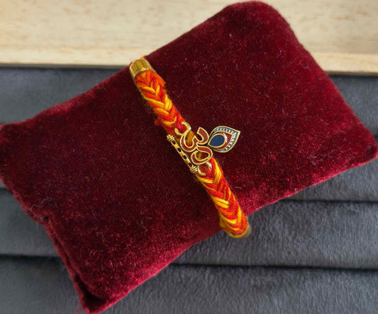 Auspicious Lord Krishna Morpankh &amp; Om Rakhi with Golden Flute Accent