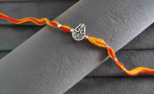Auspicious Silver Toned Shiv Trishul Rakhi for Brother