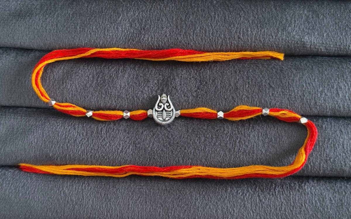 Auspicious Silver Toned Shiv Trishul Rakhi for Brother