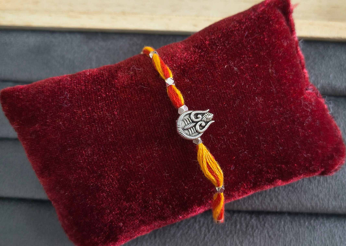 Auspicious Silver Toned Shiv Trishul Rakhi for Brother