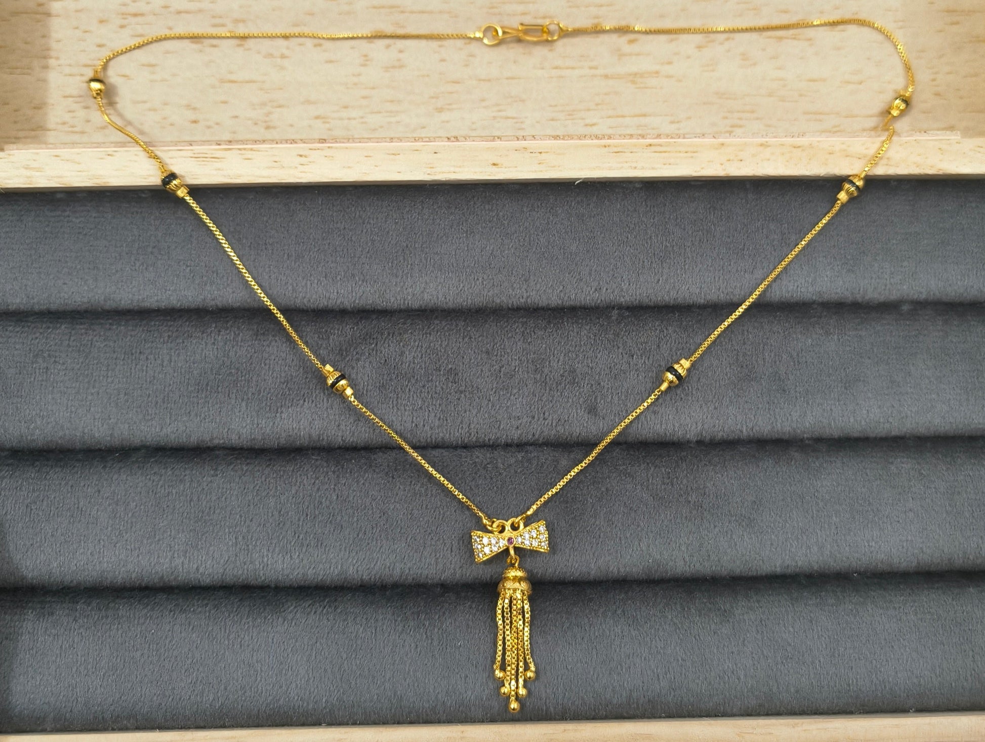 Daily Wear Black Beaded Classic Bow Pendant Mangalsutra