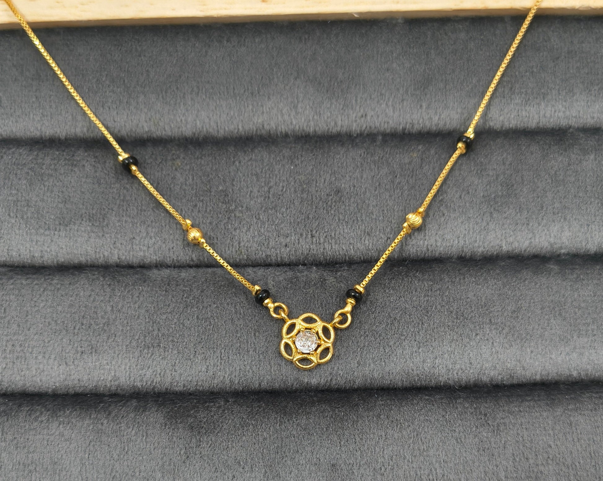 Daily Wear Black Beaded Floral Solitaire Pendant Mangalsutra