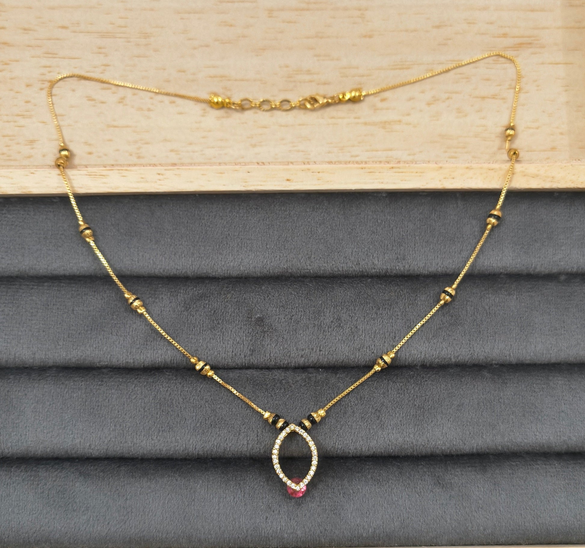 Daily Wear Black Beaded Hollow Oval Pendant Mangalsutra