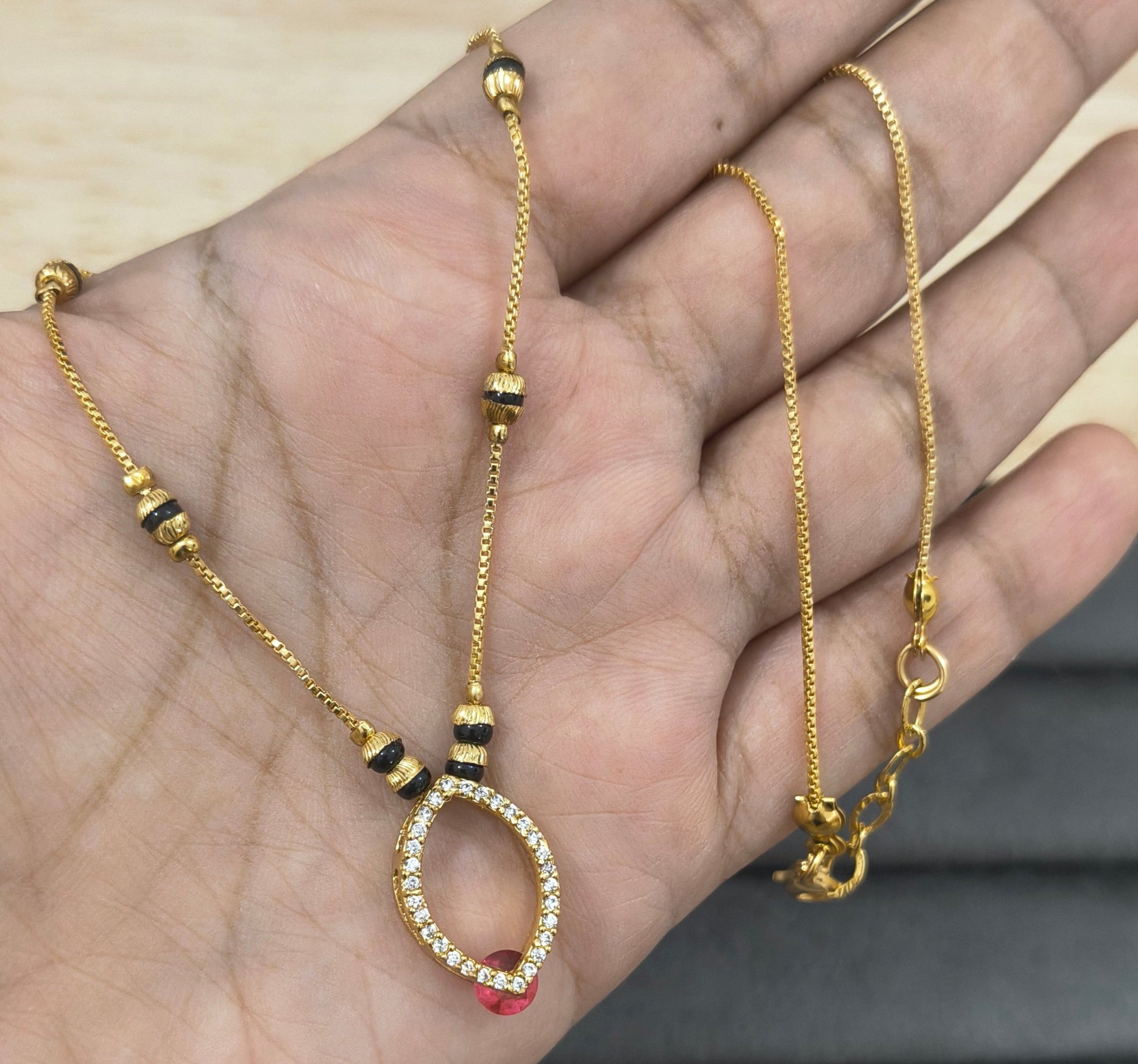 Daily Wear Black Beaded Hollow Oval Pendant Mangalsutra