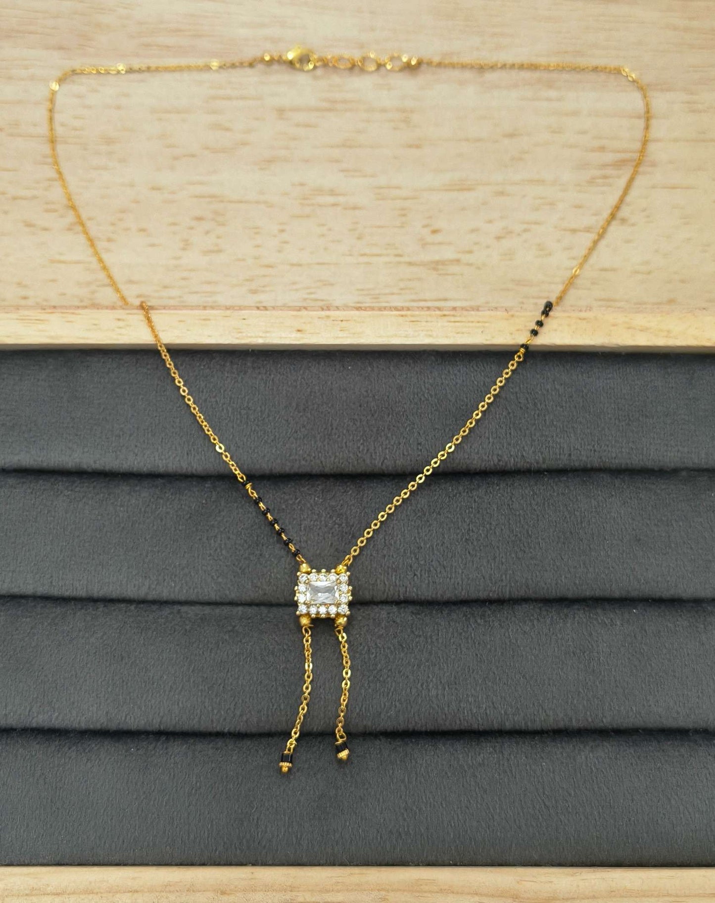 Modern Micro gold plated daily wear mangalsutra with rectangular CZ diamond pendant and invisible black bead chain