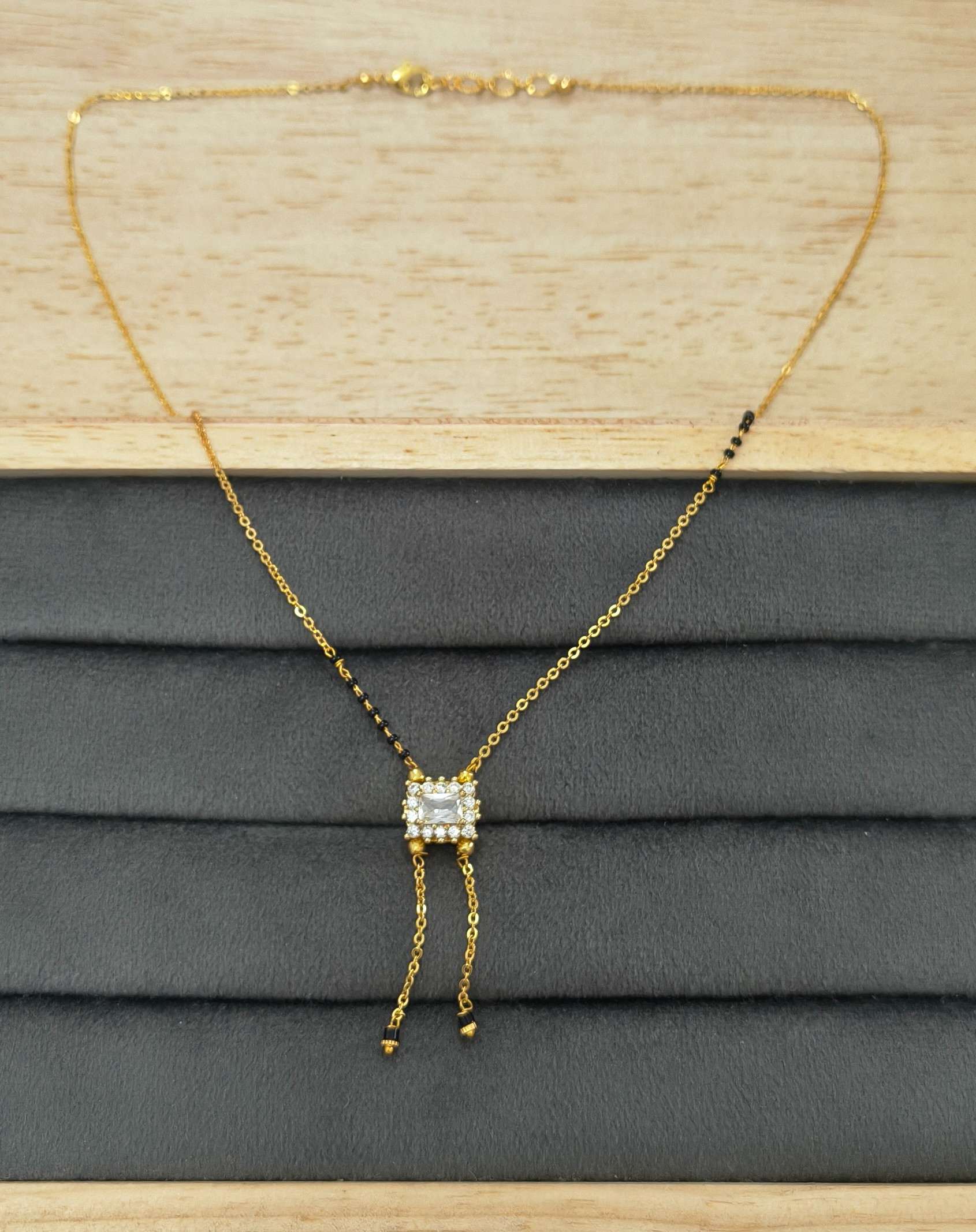 Modern Micro gold plated daily wear mangalsutra with rectangular CZ diamond pendant and invisible black bead chain