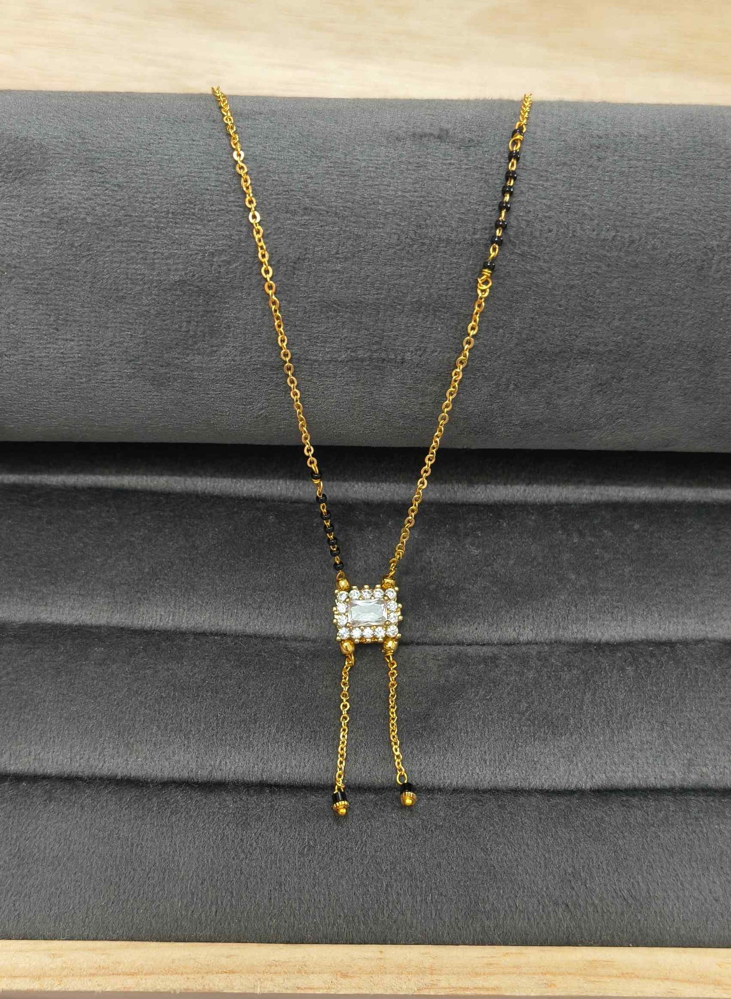 Modern Micro gold plated daily wear mangalsutra with rectangular CZ diamond pendant and invisible black bead chain