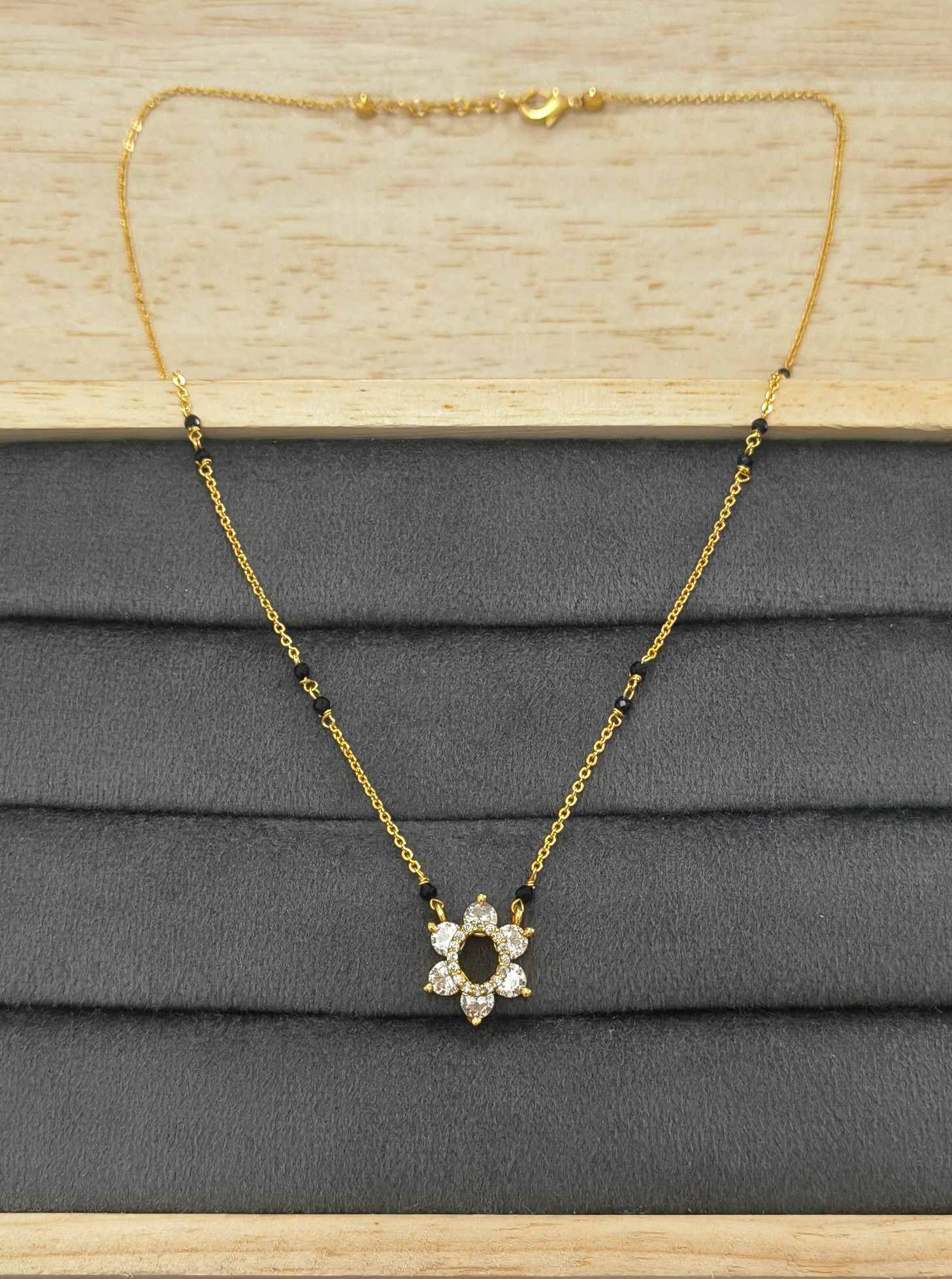 Daily Wear Mangalsutra with Shiny Diamond Flower Pendant