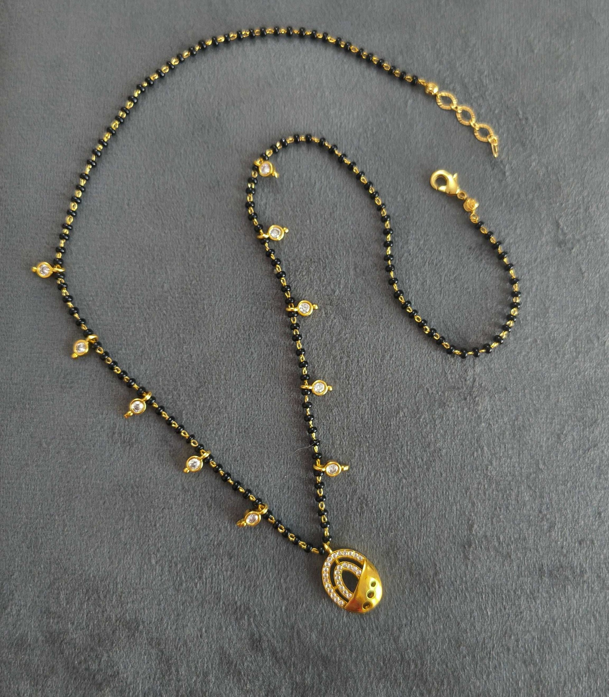 Dazzling Stone Studded Oval Pendant Beaded Mangalsutra Chain