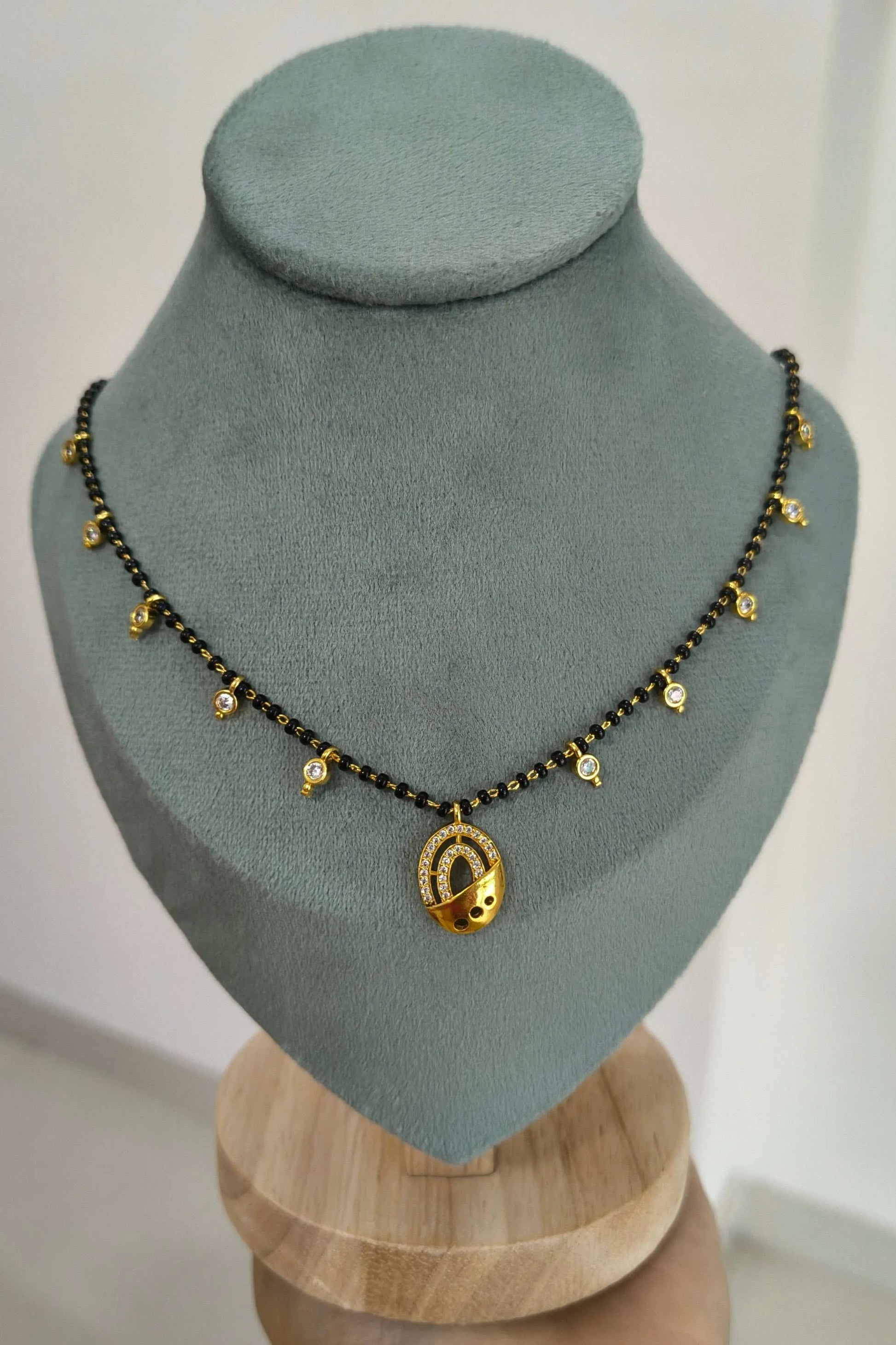 Dazzling Stone Studded Oval Pendant Beaded Mangalsutra Chain