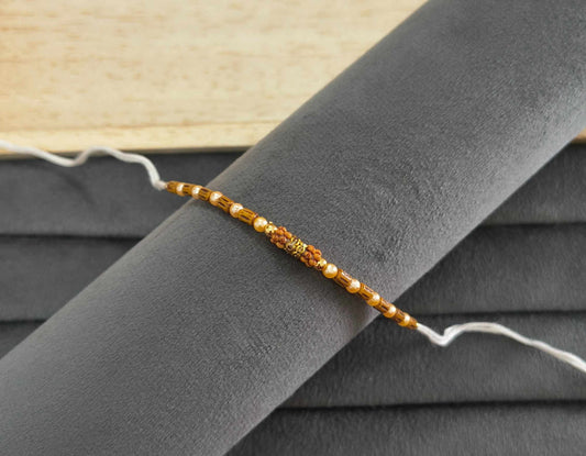 Designer Golden and Wooden Beads Rakhi for Brother