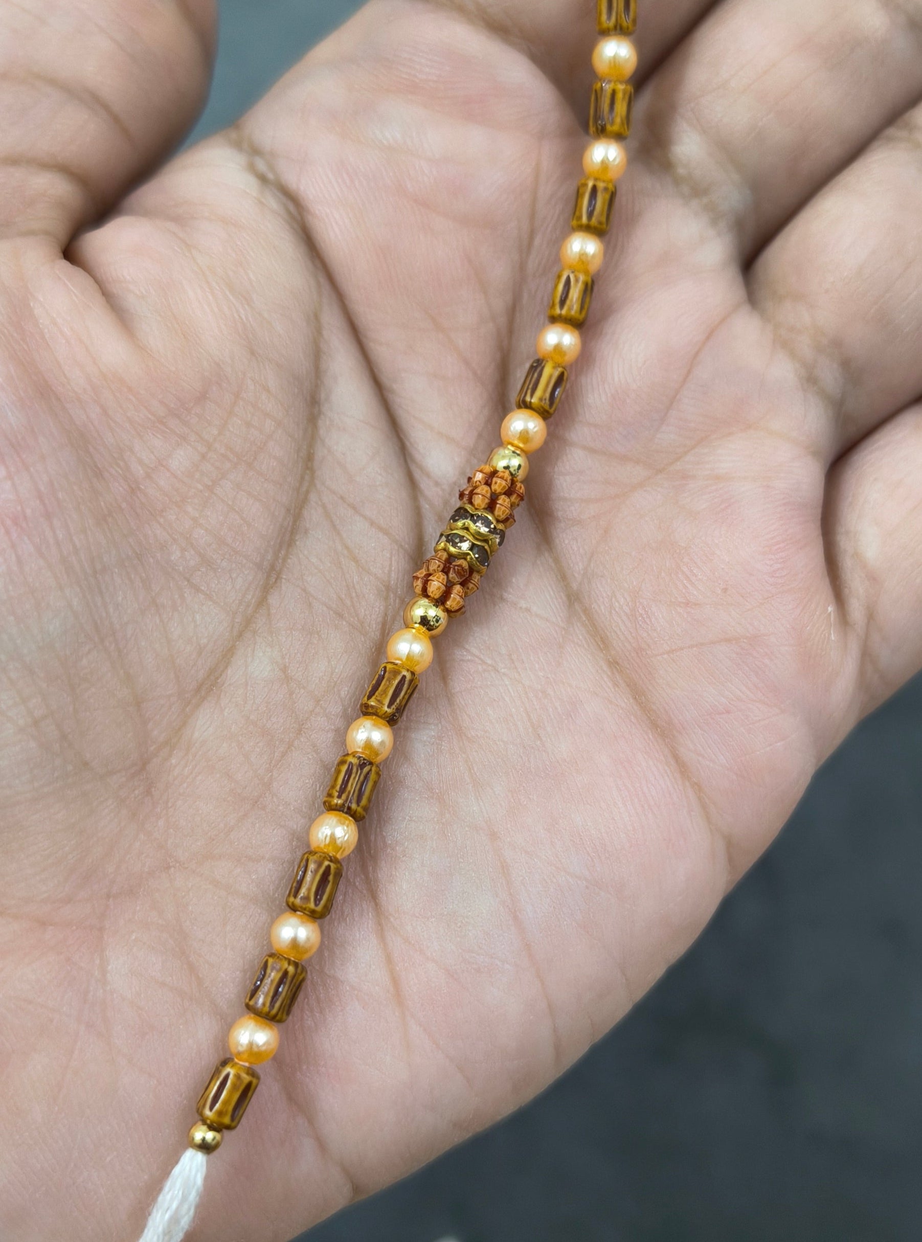 Designer Golden and Wooden Beads Rakhi for Brother