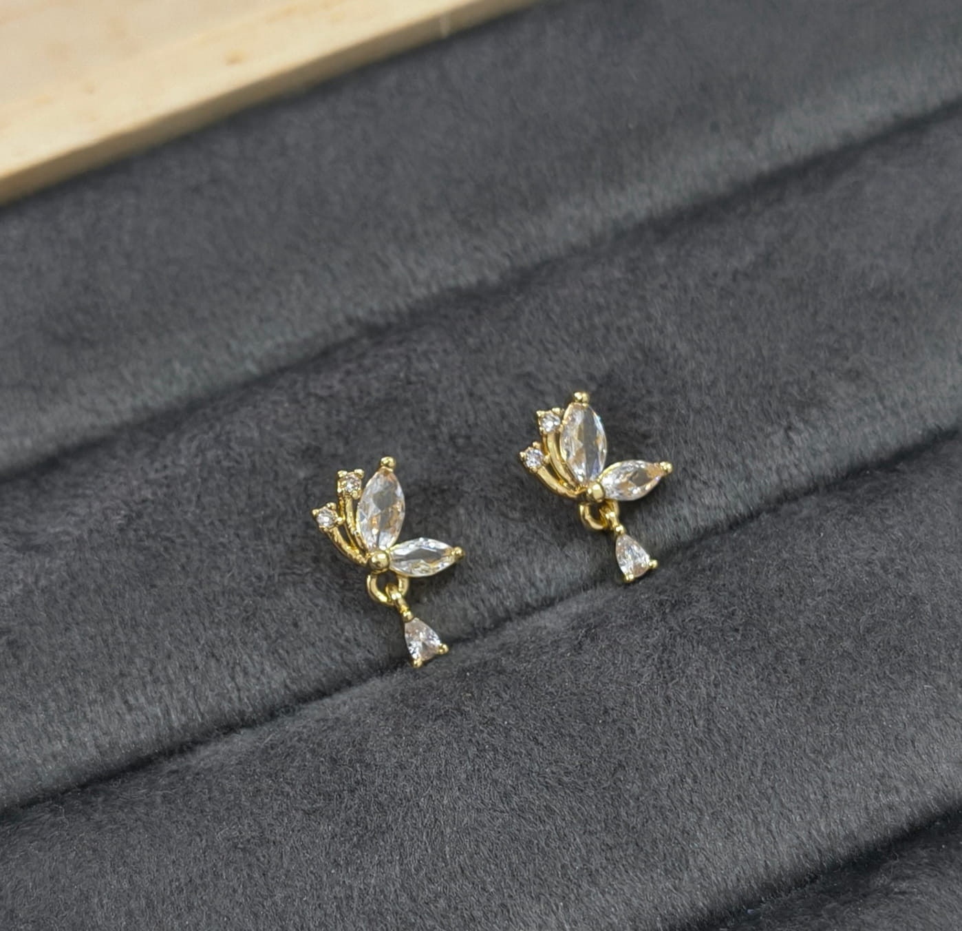 Gold earrings with clear stones