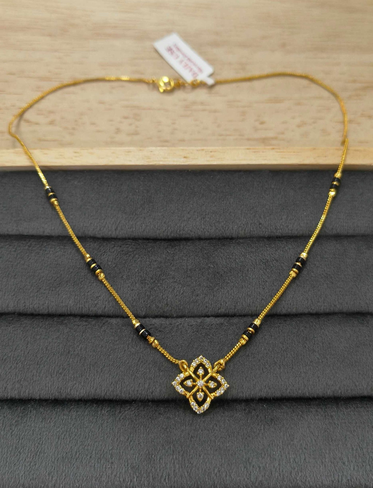 Daily Wear Mangalsutra Black Beaded AD Flower Pendant