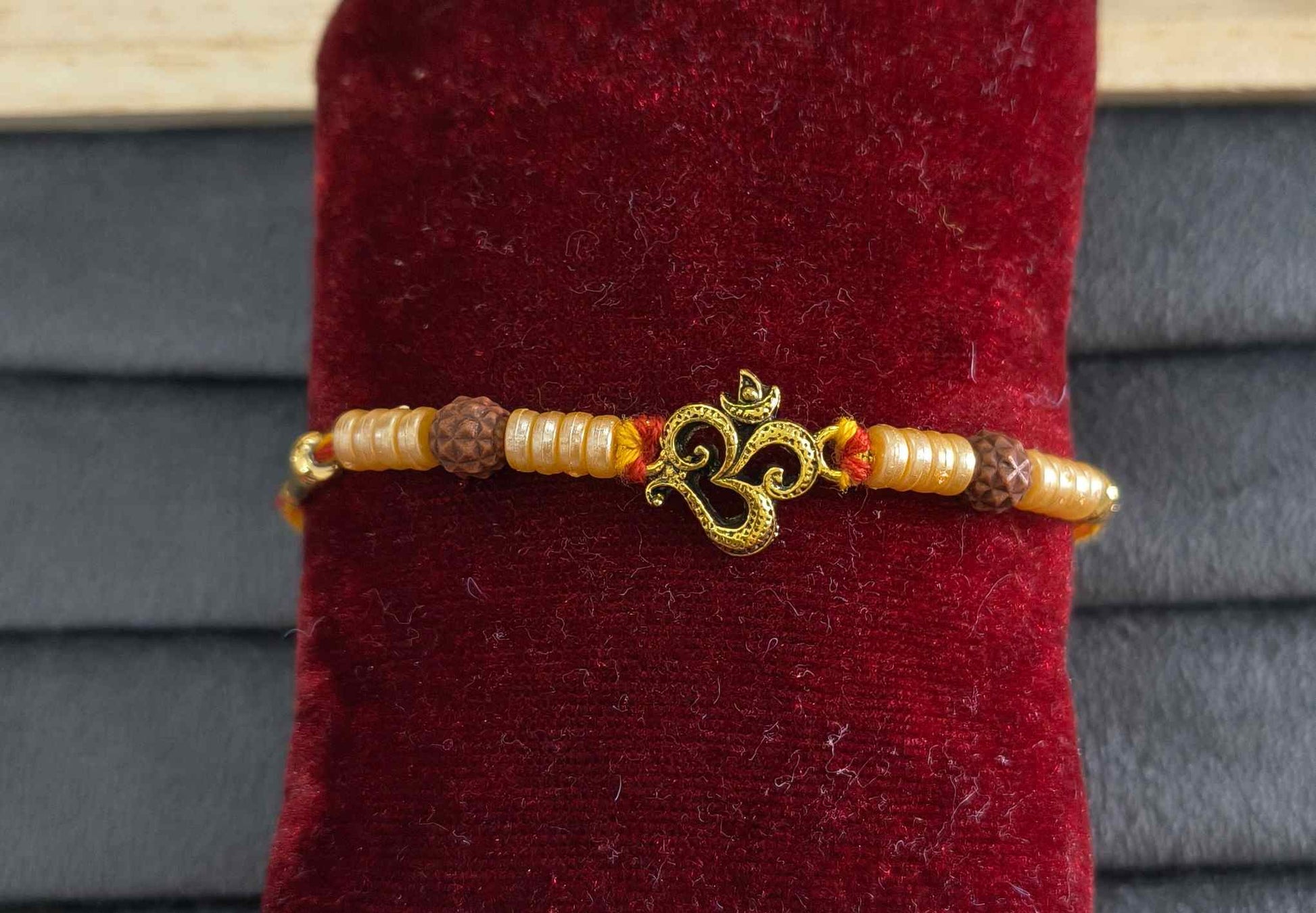 Premium Divine Om Rakhi with Pearl Beads for Brother