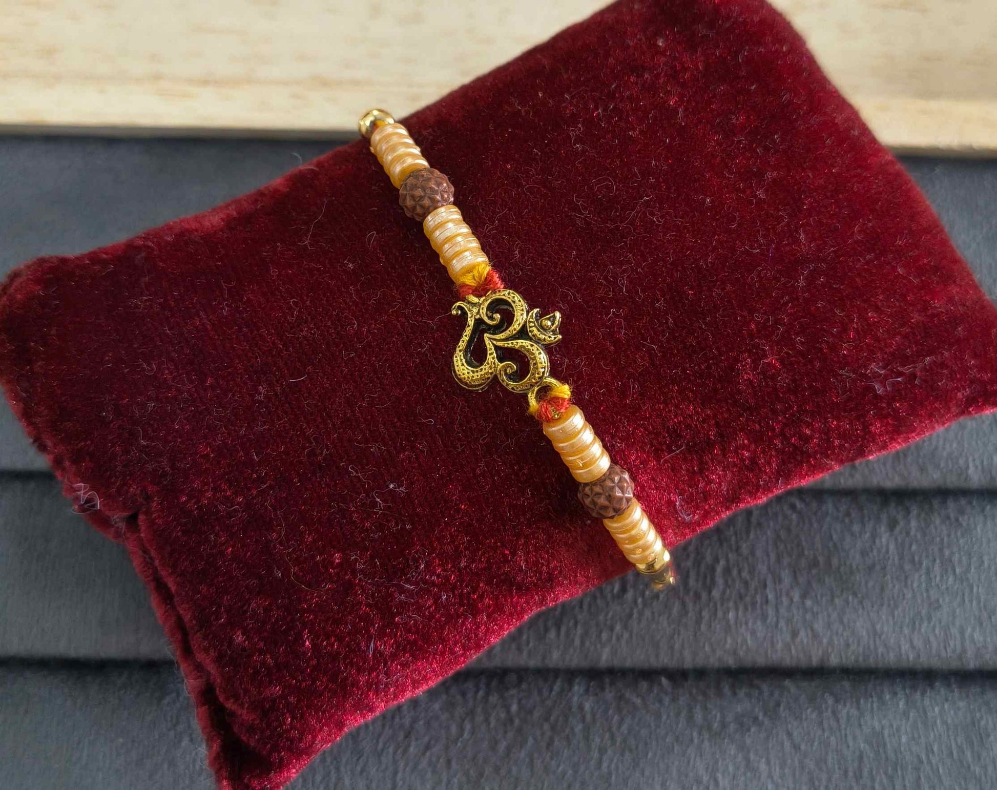 Premium Divine Om Rakhi with Pearl Beads for Brother
