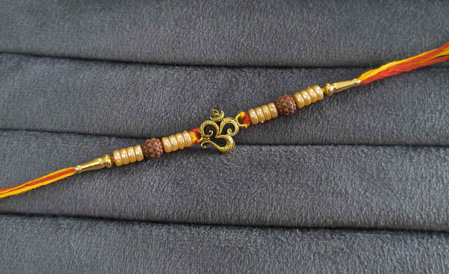 Premium Divine Om Rakhi with Pearl Beads for Brother