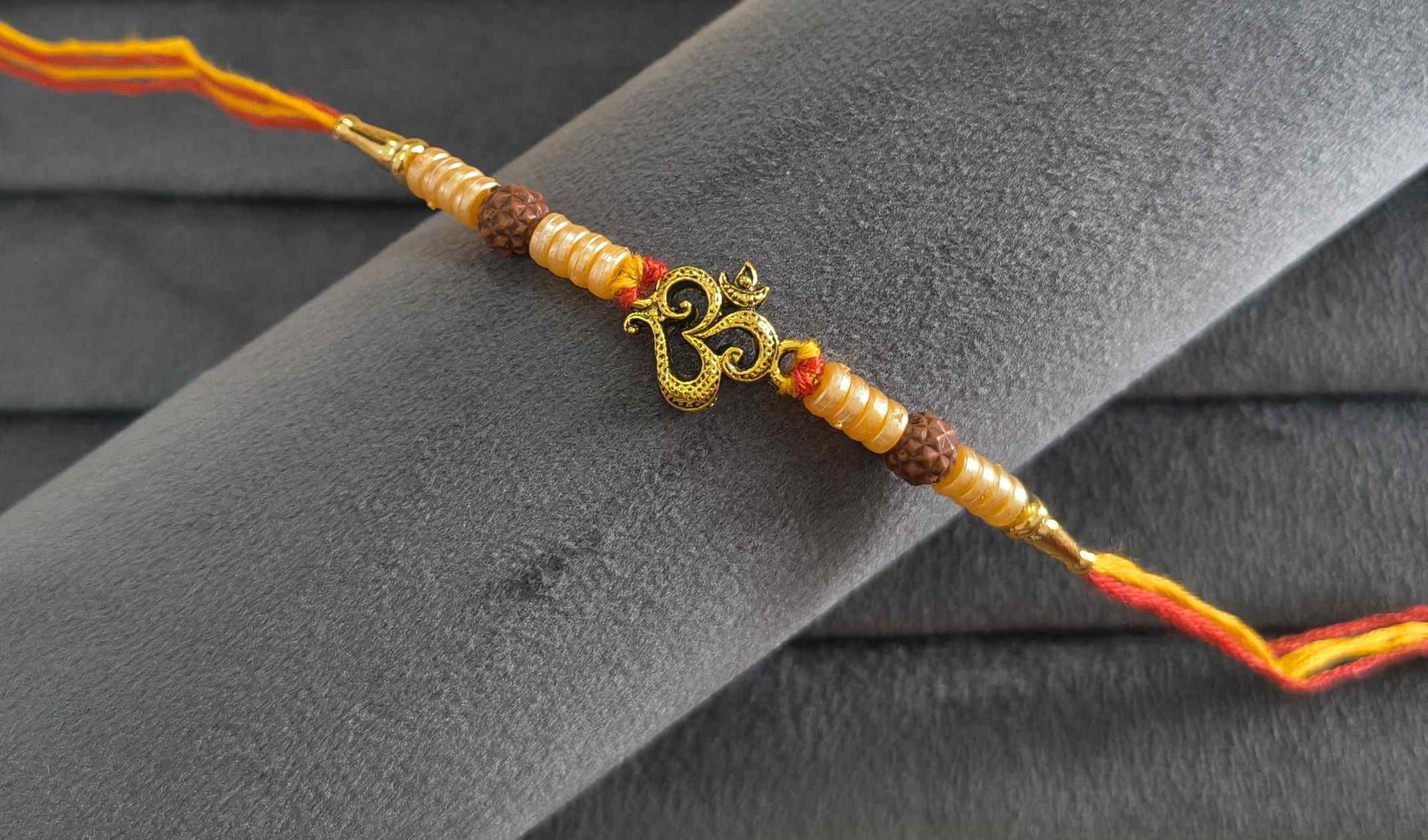 Premium Divine Om Rakhi with Pearl Beads for Brother